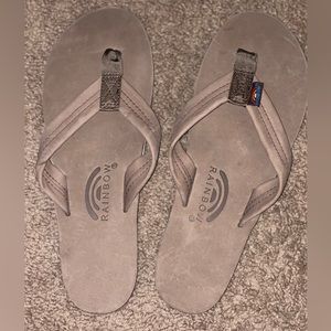Never worn—- rainbow flip flops